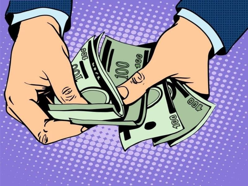 hands giving cash as a metaphor for a good payout ratio