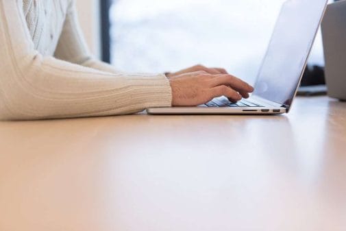 person typing on computer