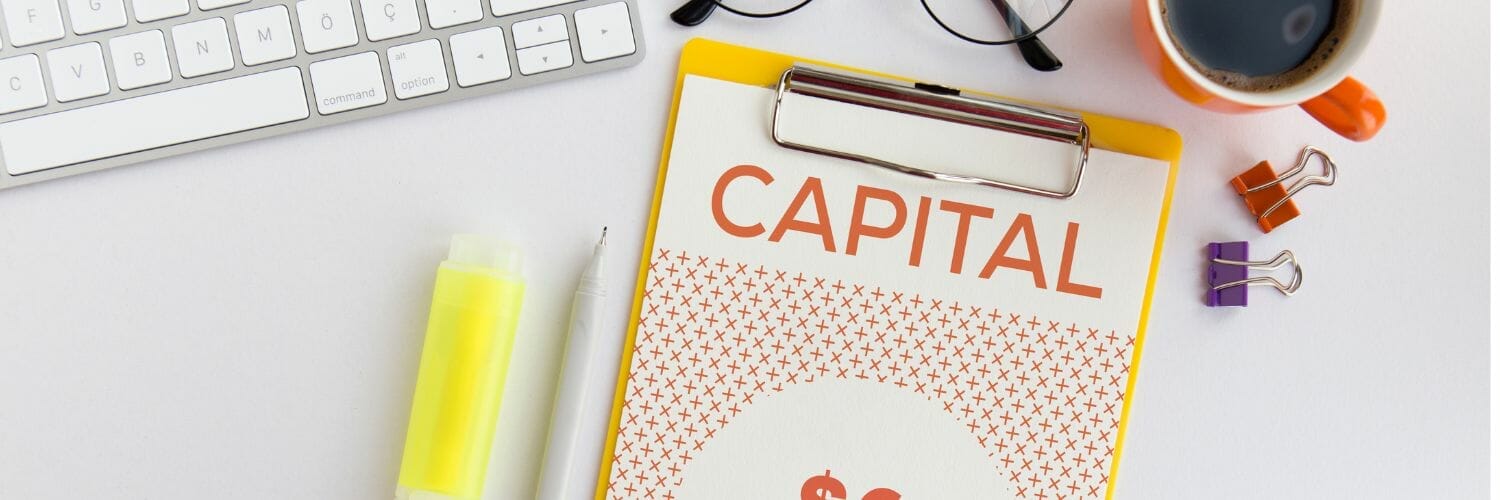 a note pad with the word capital on it