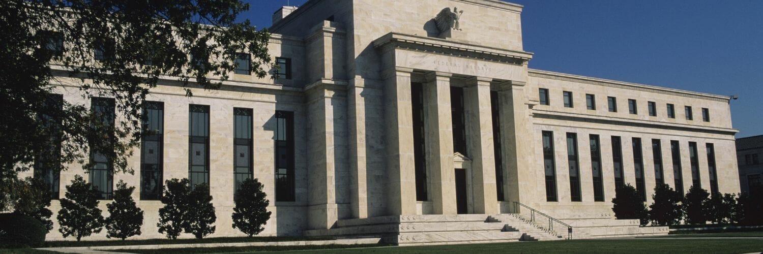 A large white building with columns
Description automatically generated with low confidence