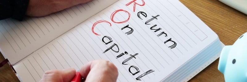 the words return on capital written on a notepad