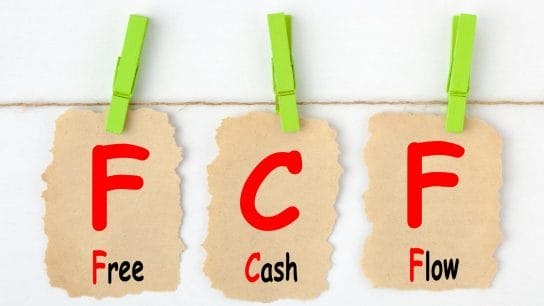 pieces of paper saying free cash flow