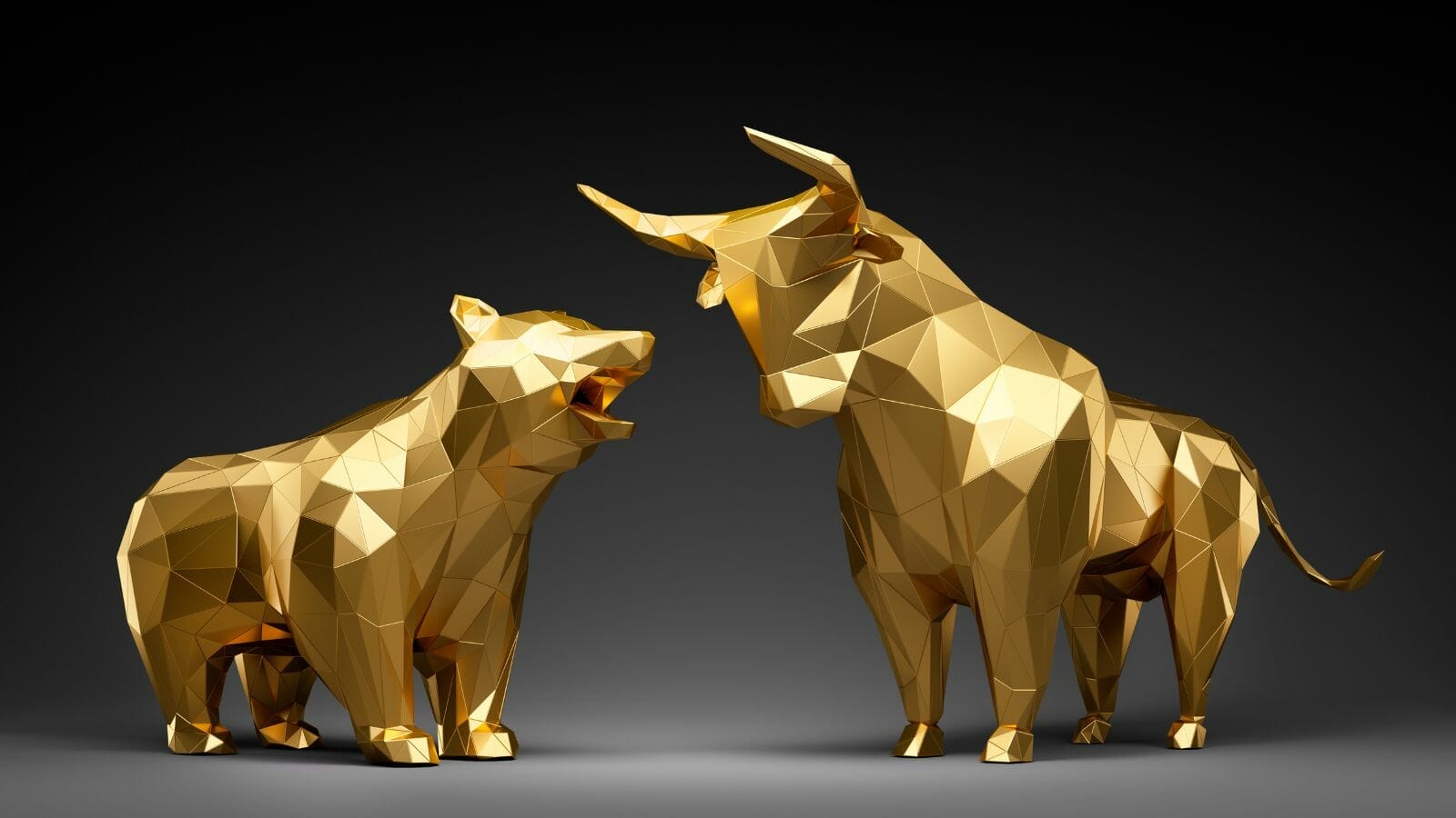 A gold bull and bear statues

