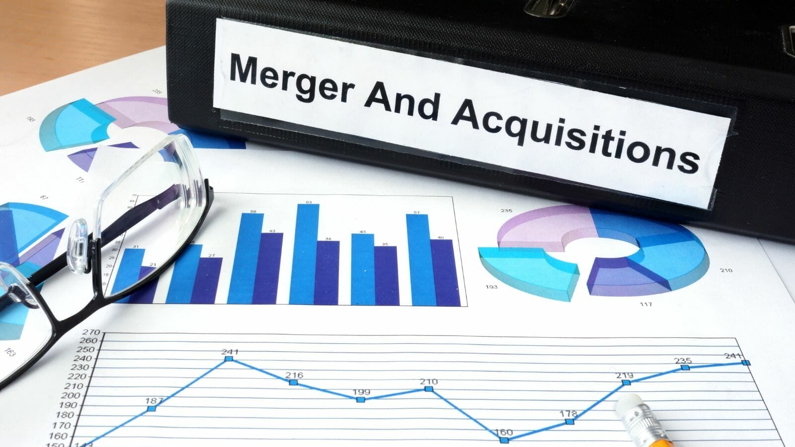 A close-up of a folder merger and aquisitions

