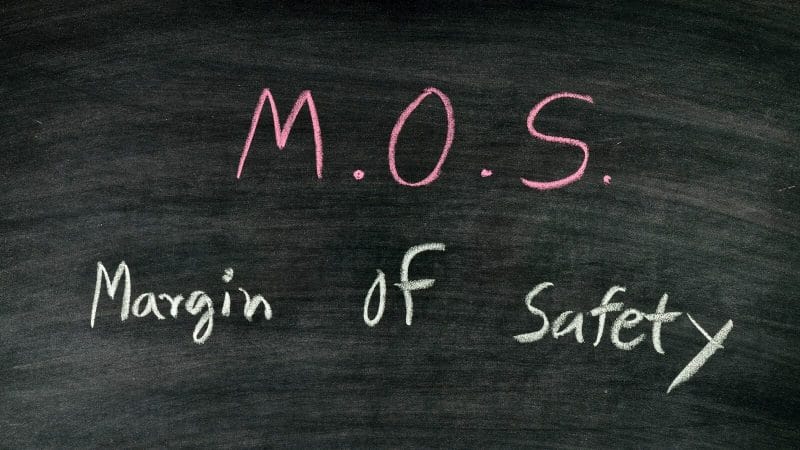 A picture containing handwriting, blackboard, chalk, text with the term margin of safety

Description automatically generated