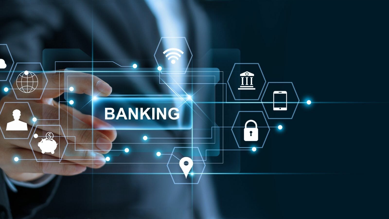 A hand touching a screen with icons saying banking