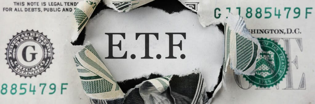 a ripped dollar bill with E.T.F. written on it