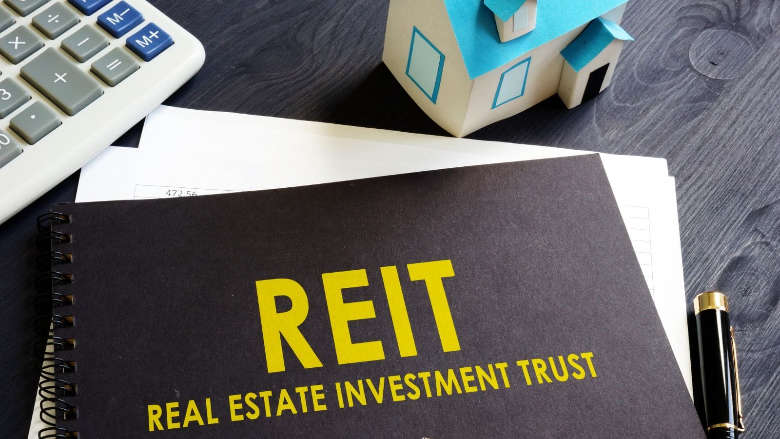 A picture containing the word REIT

