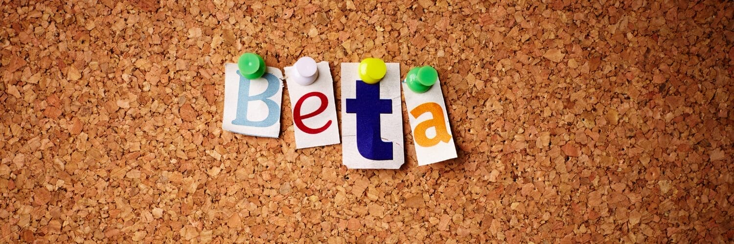 Letters spelling Beta pinned on corkboard