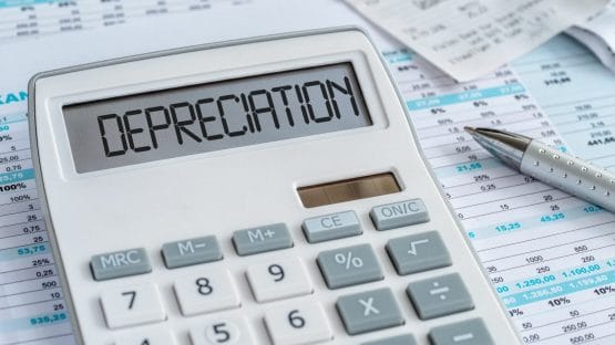 A calculator with a screen on it saying "depreciation"

