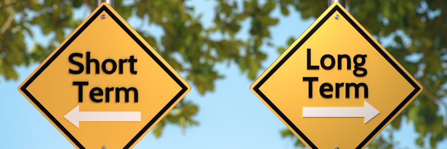 Two road signs saying short-term and long-term