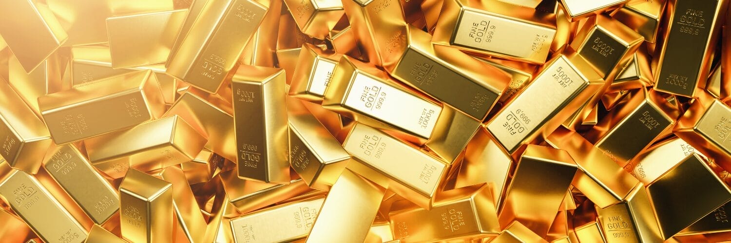 A pile of gold bars
Description automatically generated