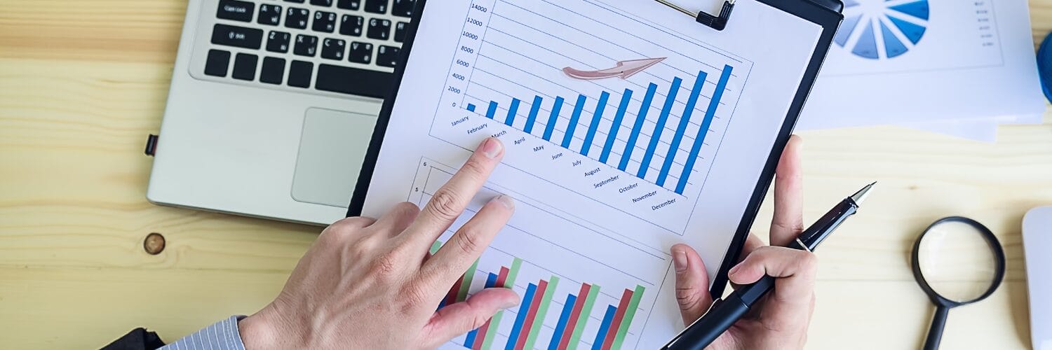 A person looking at bar chart going upwards