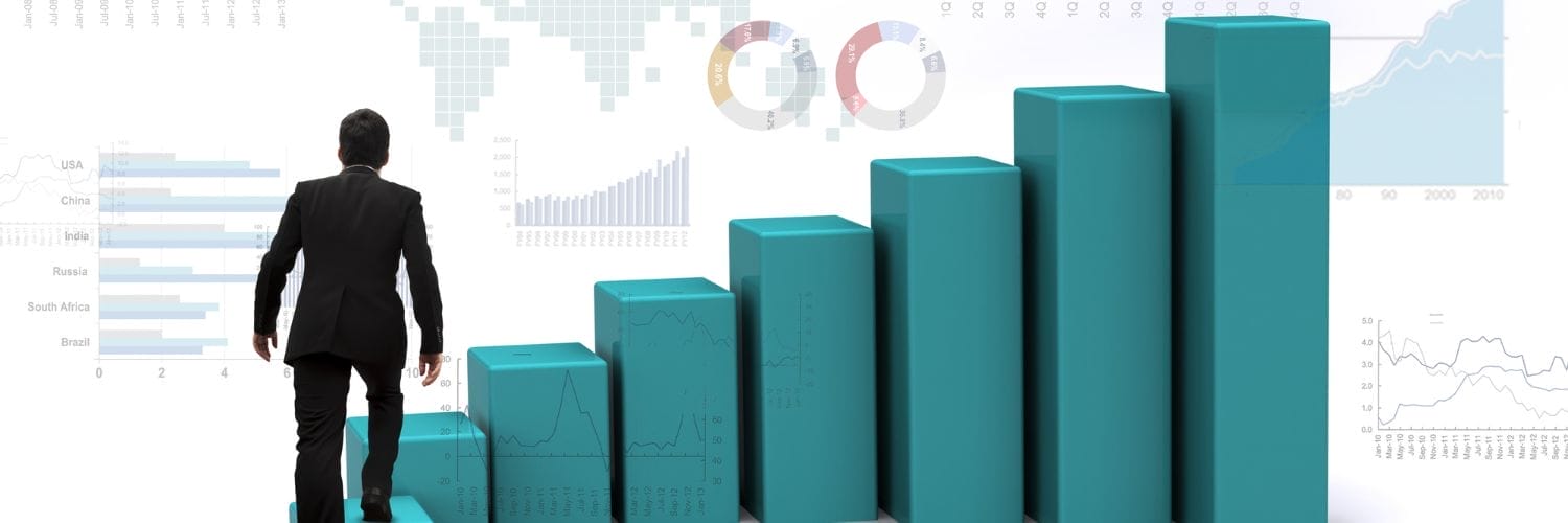 A person walking up a bar chart like stairs