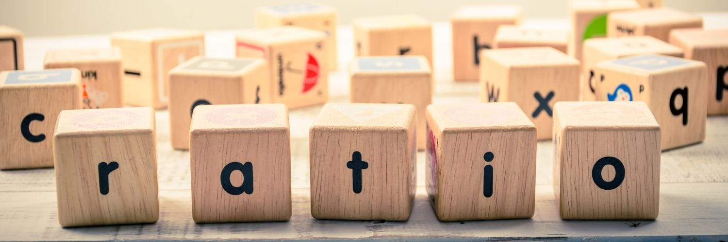 wooden dice spelling out ratio