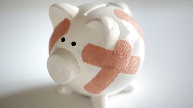 Piggy bank with bandages on it