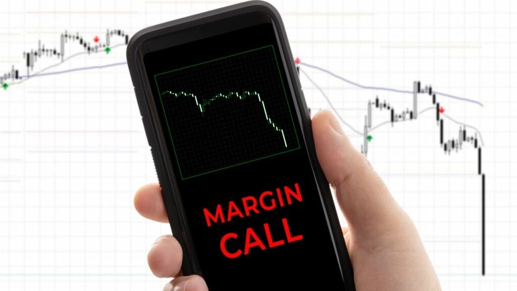 a phone with a stock chart and the words "MARGIN CALL"