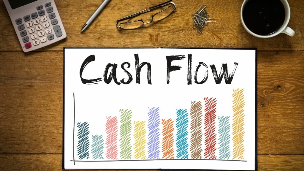 a white board with "cash flow" and bars drawn on it